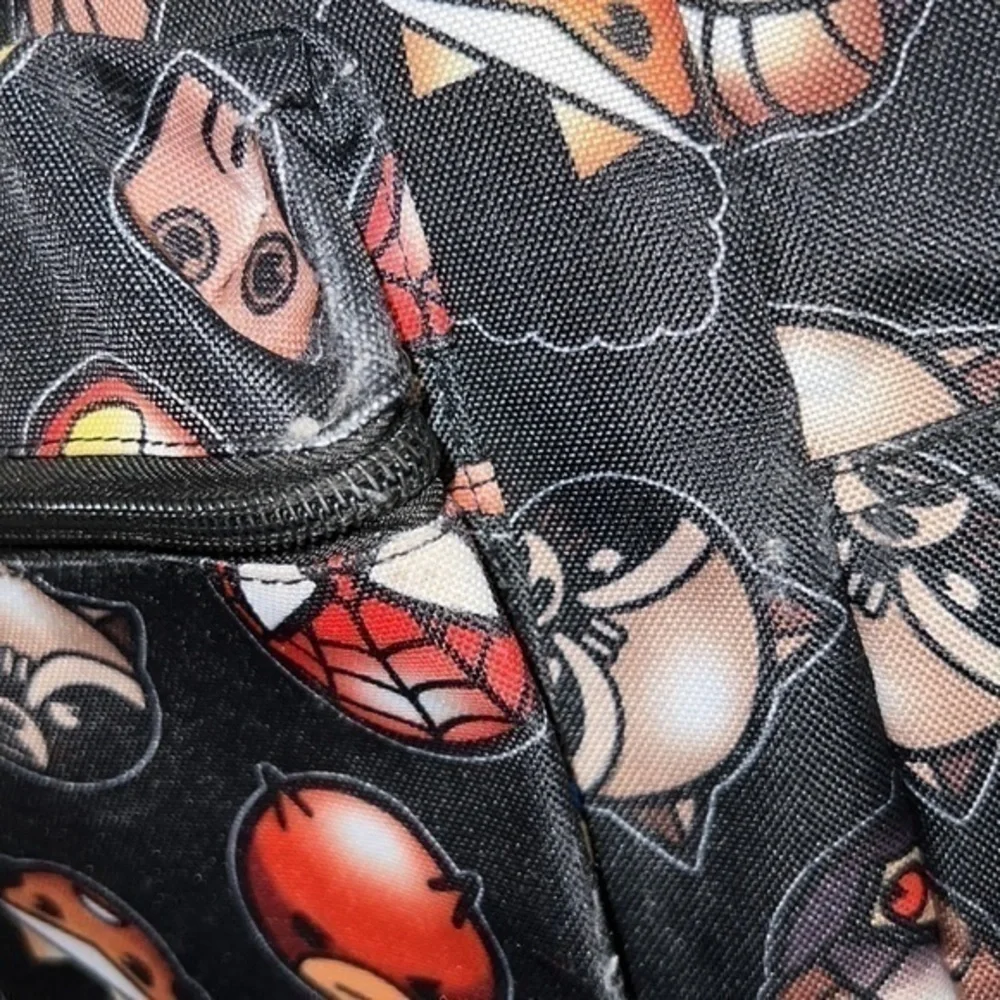 Marvel backpack. Some scuffs throughout but otherwise in good condition.
